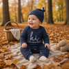 CuddleBaby – Ciao, sono nuova qui – Set composto da tutina per neonati e berretto