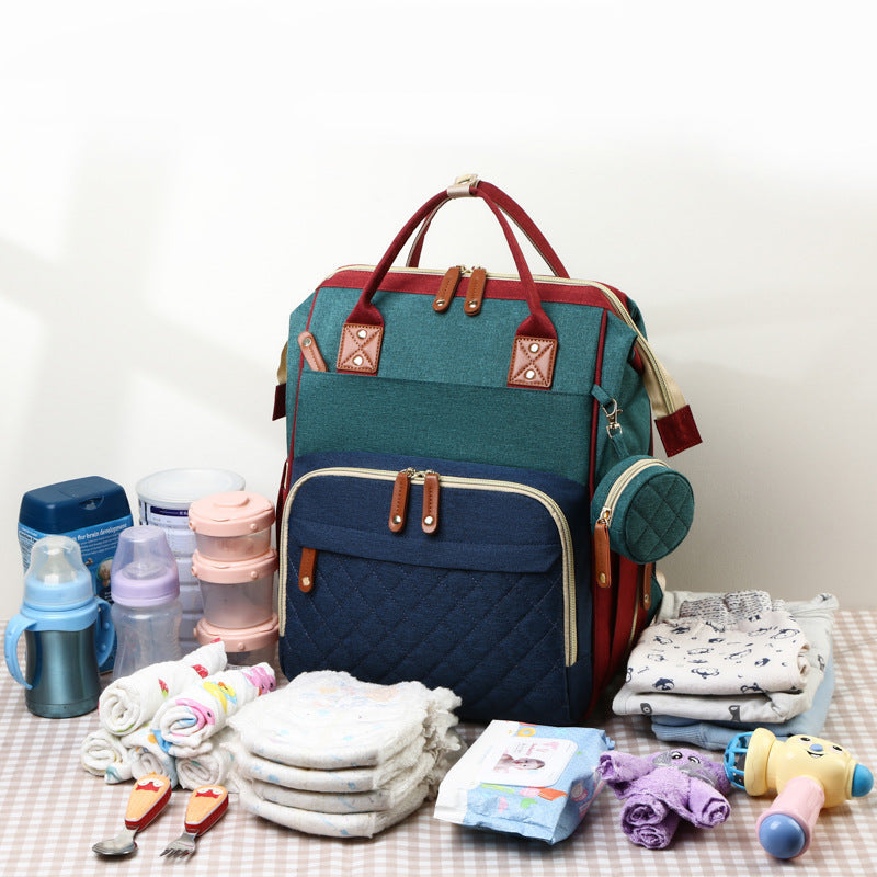 TravelNest – Sempre un posto dove riposare – Borsa per pannolini 2 in 1 con lettino per bambini